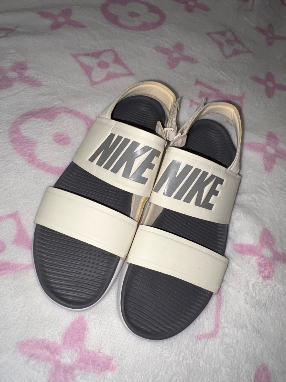 Nike women’s Cream and Black Double-Strap Slide Sandals